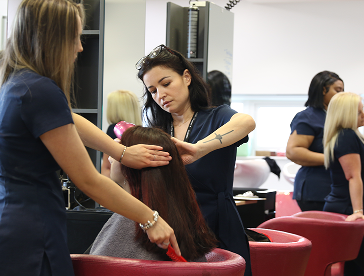 students working in a hair salon
